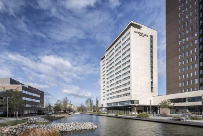 Courtyard by Marriot hotel Brno - building from outside by artificial lake