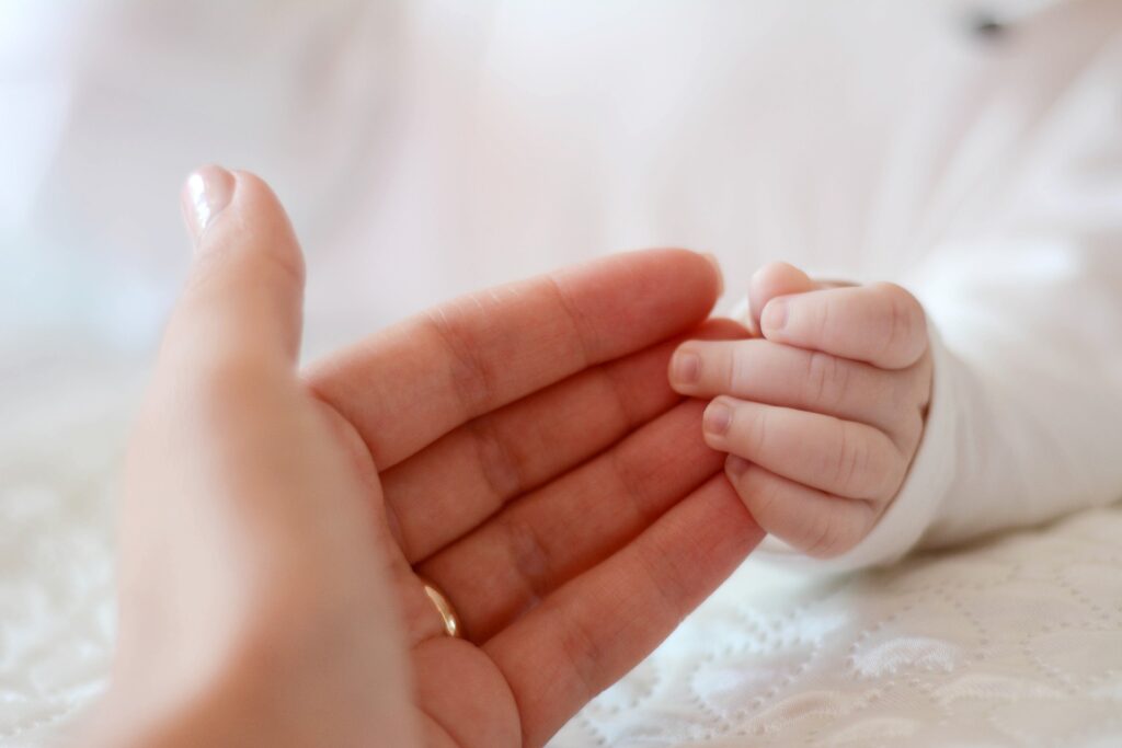 IVF medical clinic Brno - woman and baby hand